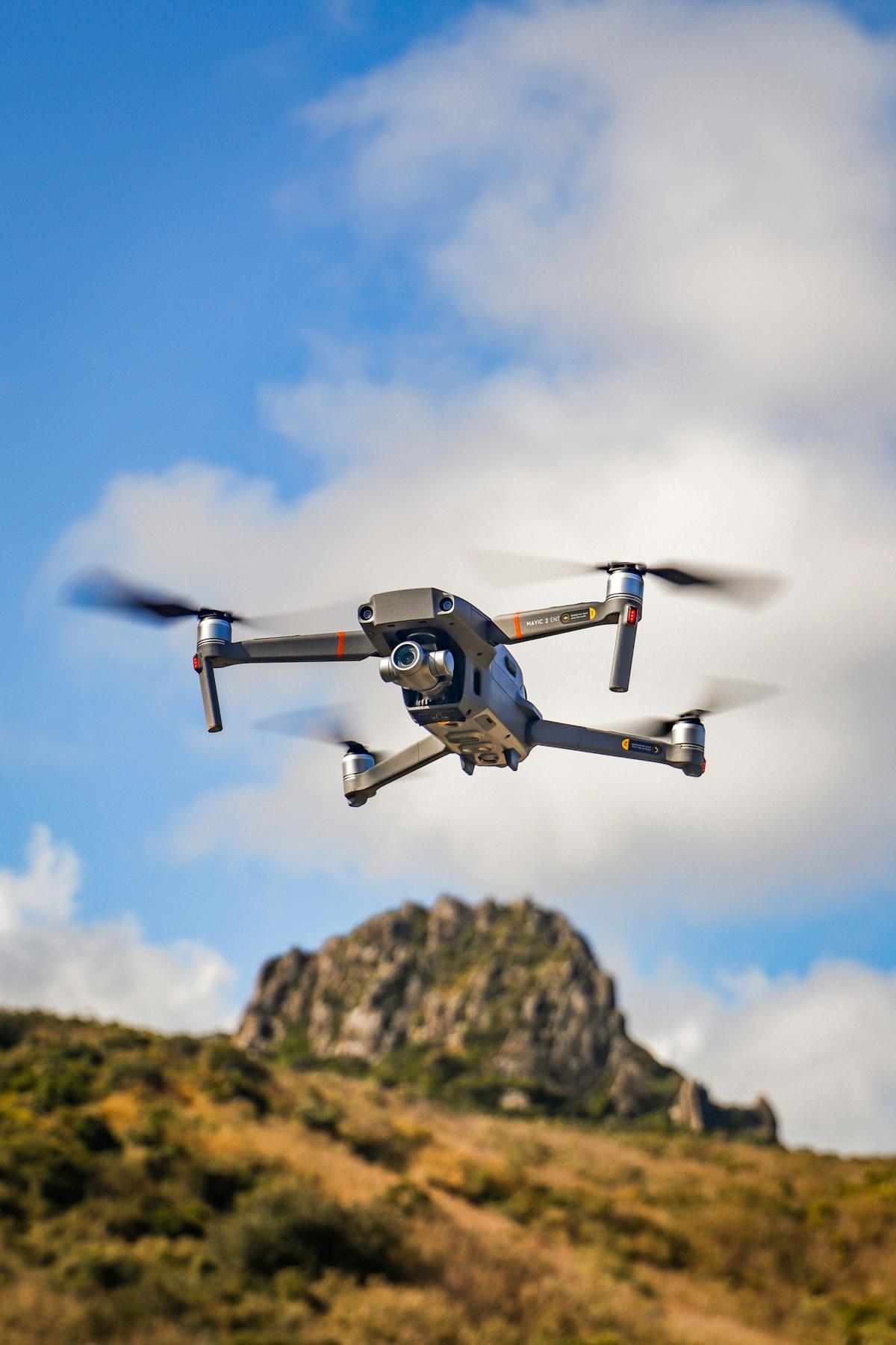 Mapping drone in flight over a hillside